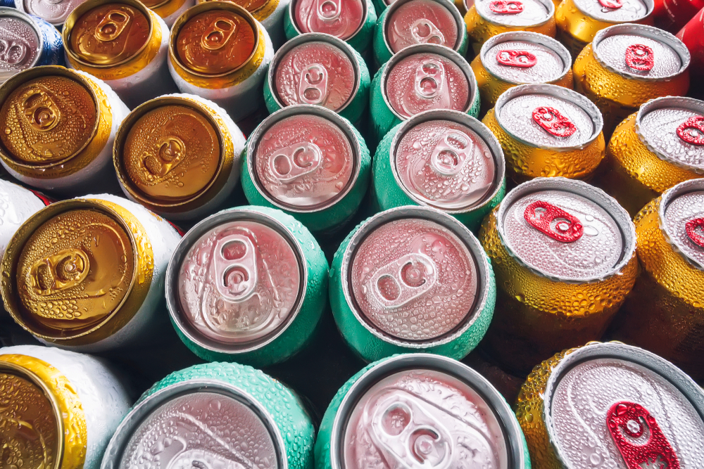 Metal,Cans,Of,Beer,With,Ice,Cubes,In,Mini,Refrigerator,